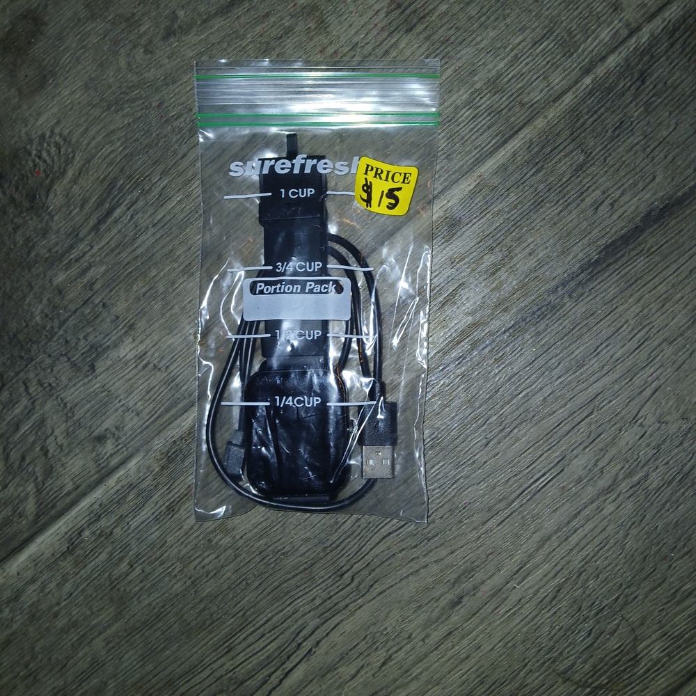 Black Smart Watch with USB Charging Cable in Clear Portion Pack